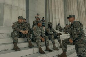 Army servicemembers sitting on courthouse steps